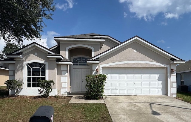 307 Dalton Ct, Davenport, FL 33897 - single story home with stucco siding, driveway, an attached garage, and central AC unit