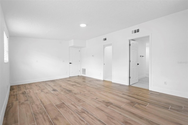 1511 E Horatio Ave, Maitland, FL 32751 - spare room featuring light wood-style flooring, baseboards, a textured ceiling, and recessed lighting