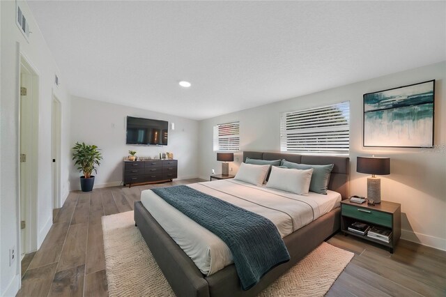 1511 E Horatio Ave, Maitland, FL 32751 - bedroom featuring baseboards, wood finished floors, and recessed lighting