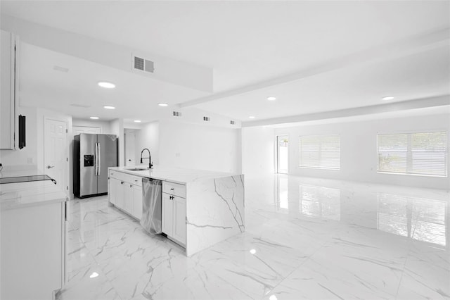 1511 E Horatio Ave, Maitland, FL 32751 - kitchen featuring appliances with stainless steel finishes, a sink, light marble finish floors, recessed lighting, and light stone counters