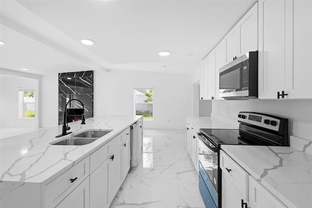 1511 E Horatio Ave, Maitland, FL 32751 - kitchen featuring stainless steel appliances, a sink, plenty of natural light, white cabinets, and recessed lighting