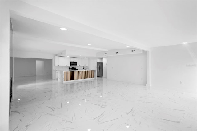 1511 E Horatio Ave, Maitland, FL 32751 - unfurnished living room with light marble finish floors, recessed lighting, and a sink