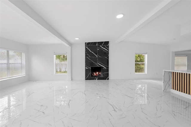 1511 E Horatio Ave, Maitland, FL 32751 - unfurnished living room featuring beamed ceiling, healthy amount of natural light, marble finish floors, recessed lighting, and a high end fireplace