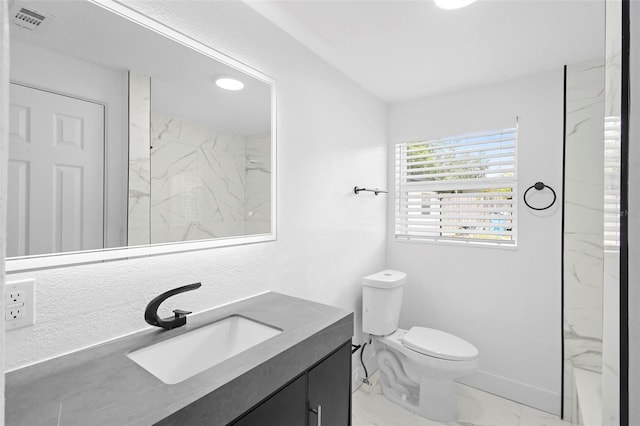 1511 E Horatio Ave, Maitland, FL 32751 - full bathroom with marble look tiles, vanity, toilet, and a marble finish shower