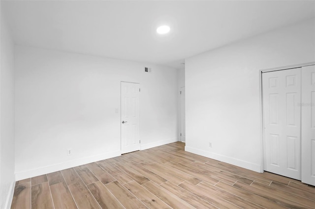1511 E Horatio Ave, Maitland, FL 32751 - unfurnished bedroom featuring light wood-type flooring, baseboards, and a closet