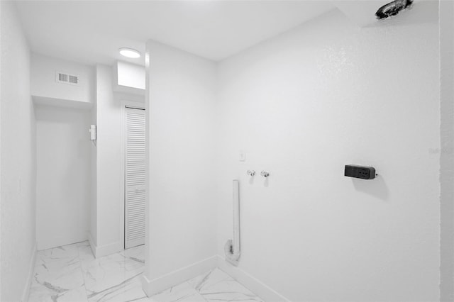 1511 E Horatio Ave, Maitland, FL 32751 - laundry area with baseboards and light marble finish flooring