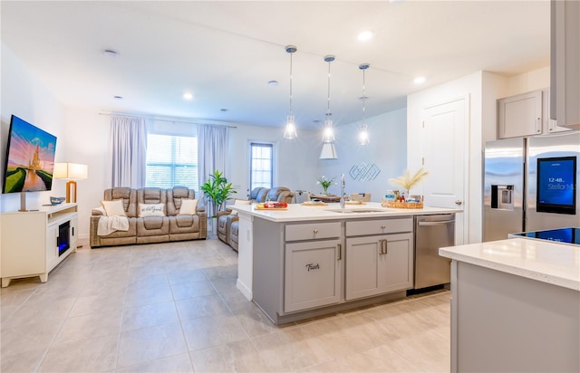 665 Longboat Dr, Davenport, FL 33896 - kitchen featuring stainless steel appliances, a sink, gray cabinets, open floor plan, and recessed lighting