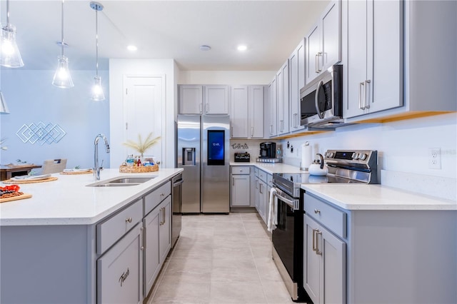 665 Longboat Dr, Davenport, FL 33896 - kitchen featuring stainless steel appliances, gray cabinets, a sink, light countertops, and recessed lighting