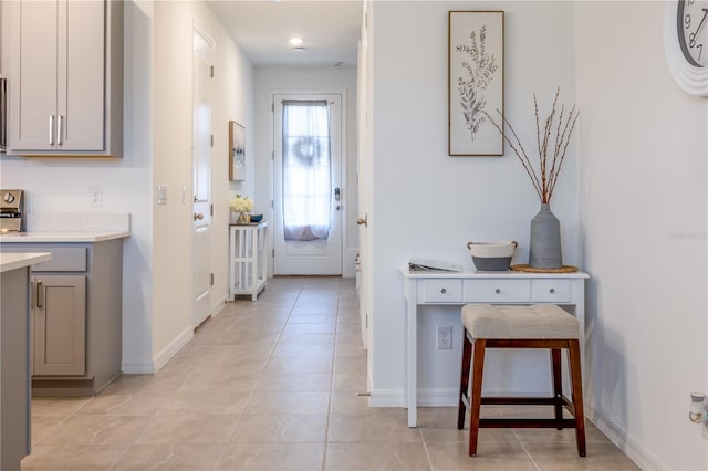 665 Longboat Dr, Davenport, FL 33896 - entryway with light tile patterned floors and baseboards