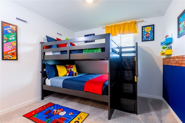 665 Longboat Dr, Davenport, FL 33896 - carpeted bedroom with baseboards and a textured ceiling