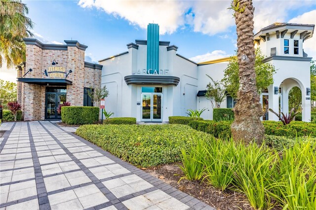 665 Longboat Dr, Davenport, FL 33896 - rear view of house featuring stucco siding
