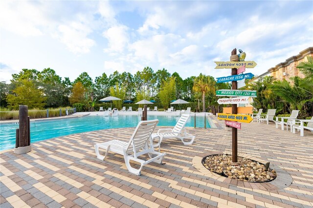 665 Longboat Dr, Davenport, FL 33896 - community pool featuring a patio area