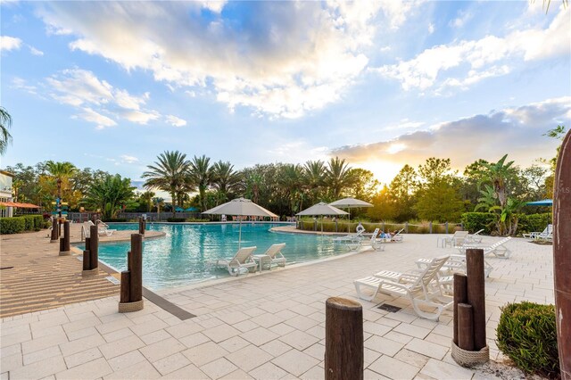 665 Longboat Dr, Davenport, FL 33896 - community pool featuring a patio area