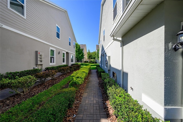 978 E 10th St, Apopka, FL 32703 - view of property exterior with stucco siding and a residential view