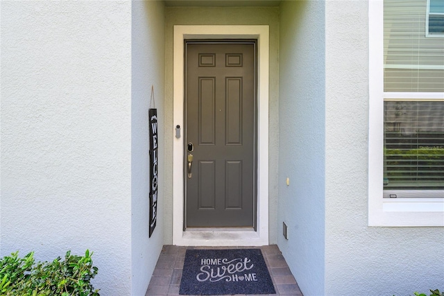 978 E 10th St, Apopka, FL 32703 - entrance to property featuring stucco siding