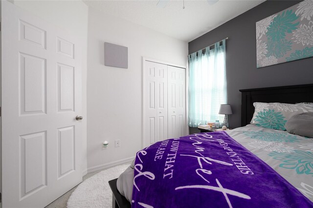 978 E 10th St, Apopka, FL 32703 - carpeted bedroom with a closet, baseboards, and ceiling fan