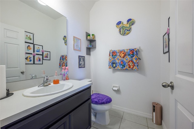 978 E 10th St, Apopka, FL 32703 - bathroom with toilet, vanity, tile patterned floors, and baseboards