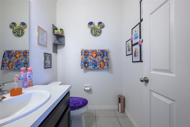 978 E 10th St, Apopka, FL 32703 - half bathroom featuring vanity, toilet, tile patterned floors, and baseboards