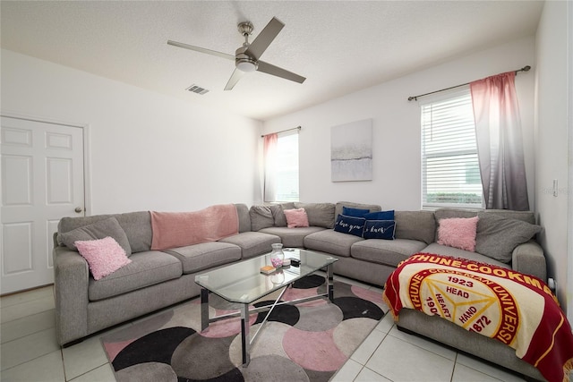 978 E 10th St, Apopka, FL 32703 - living room with tile patterned flooring and ceiling fan