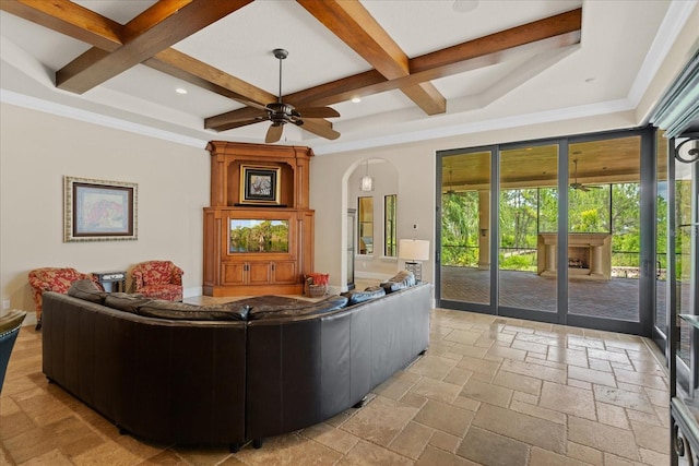 9253 Tibet Pointe Cir, Windermere, FL 34786 - living room with coffered ceiling, stone tile flooring, ceiling fan, beam ceiling, and arched walkways