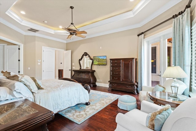 9253 Tibet Pointe Cir, Windermere, FL 34786 - bedroom featuring a raised ceiling, dark wood finished floors, ornamental molding, baseboards, and a ceiling fan