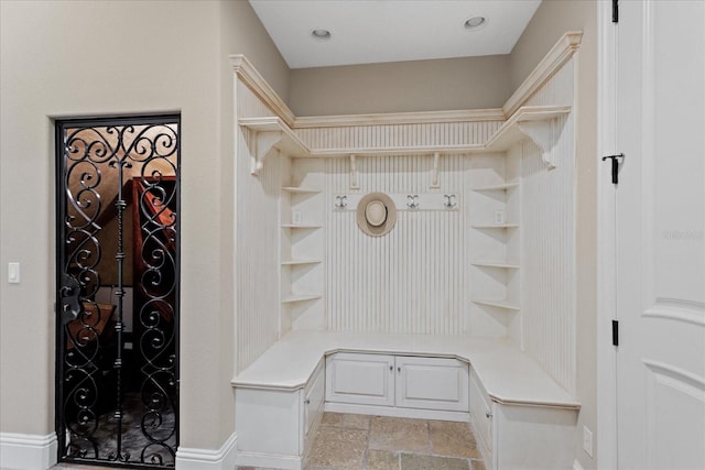 9253 Tibet Pointe Cir, Windermere, FL 34786 - mudroom featuring light stone finish floors