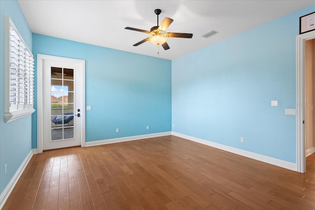 9253 Tibet Pointe Cir, Windermere, FL 34786 - empty room featuring a ceiling fan, wood finished floors, and baseboards