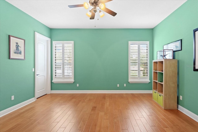 9253 Tibet Pointe Cir, Windermere, FL 34786 - unfurnished bedroom with wood finished floors, baseboards, and a ceiling fan