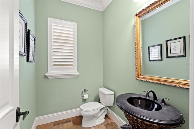 9253 Tibet Pointe Cir, Windermere, FL 34786 - half bath featuring baseboards, toilet, ornamental molding, and stone finish flooring