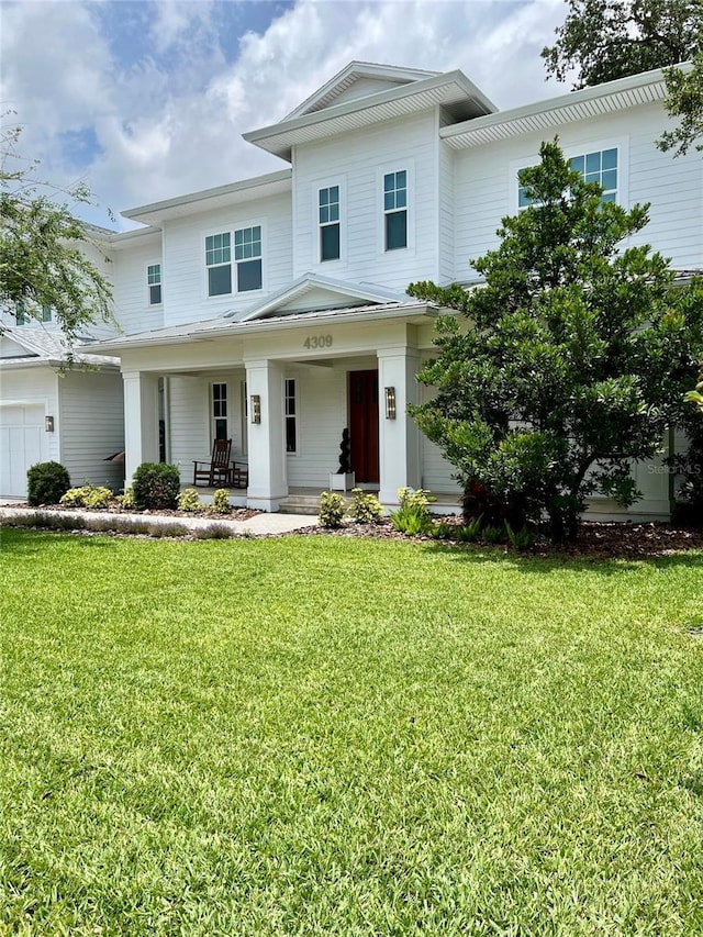 4309 W Beachway Dr, Tampa, FL 33609 - view of front of house with a porch and a front yard