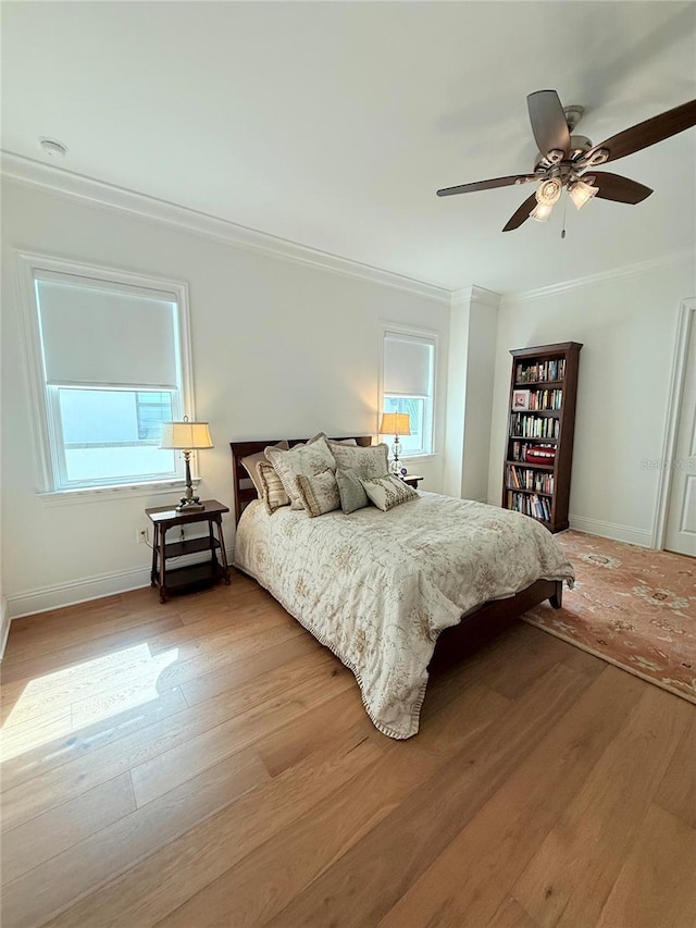 4309 W Beachway Dr, Tampa, FL 33609 - bedroom with crown molding, light wood finished floors, baseboards, and a ceiling fan