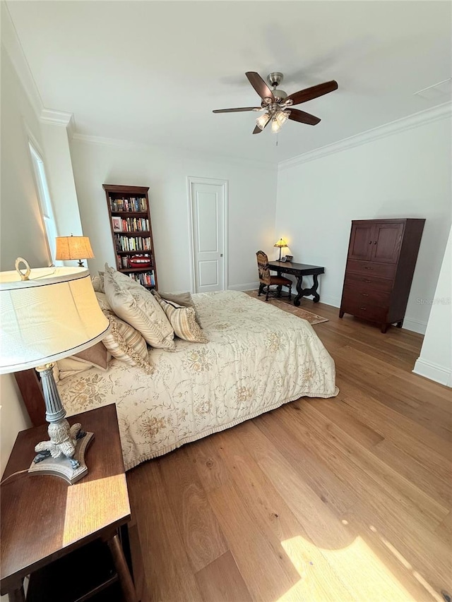 4309 W Beachway Dr, Tampa, FL 33609 - bedroom featuring crown molding, wood finished floors, ceiling fan, and baseboards