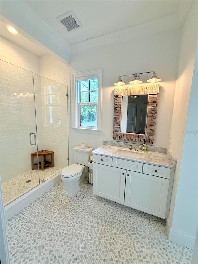 4309 W Beachway Dr, Tampa, FL 33609 - bathroom featuring a shower stall, toilet, tile patterned floors, and vanity