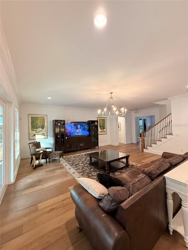 4309 W Beachway Dr, Tampa, FL 33609 - living room featuring light wood-style floors, a chandelier, ornamental molding, stairs, and recessed lighting
