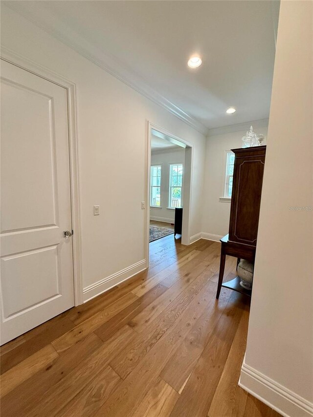 4309 W Beachway Dr, Tampa, FL 33609 - corridor with crown molding, light wood-type flooring, baseboards, and recessed lighting