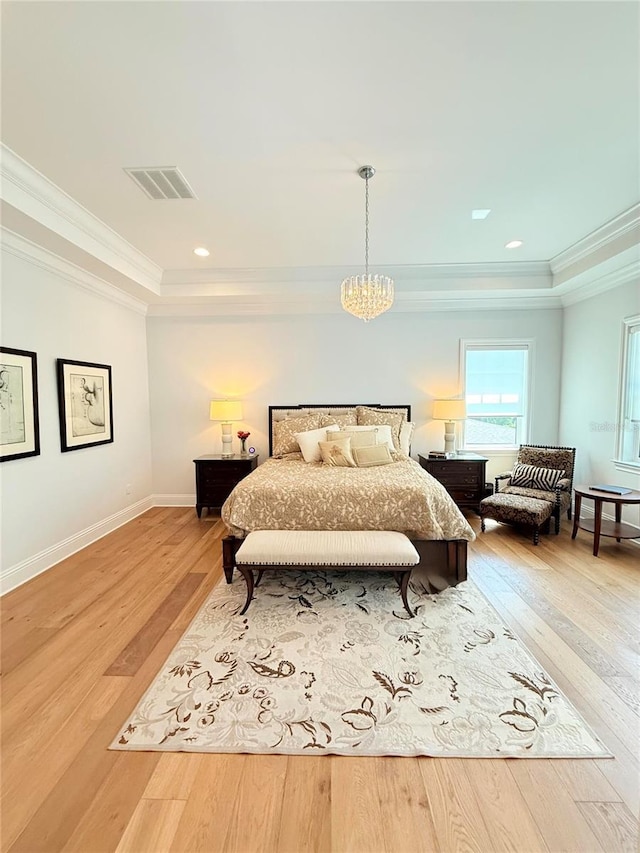 4309 W Beachway Dr, Tampa, FL 33609 - bedroom with a tray ceiling, ornamental molding, a chandelier, light wood-type flooring, and baseboards