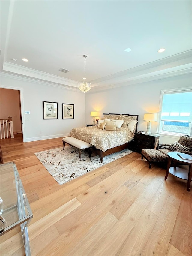 4309 W Beachway Dr, Tampa, FL 33609 - bedroom featuring crown molding, light wood-style floors, a chandelier, baseboards, and a tray ceiling