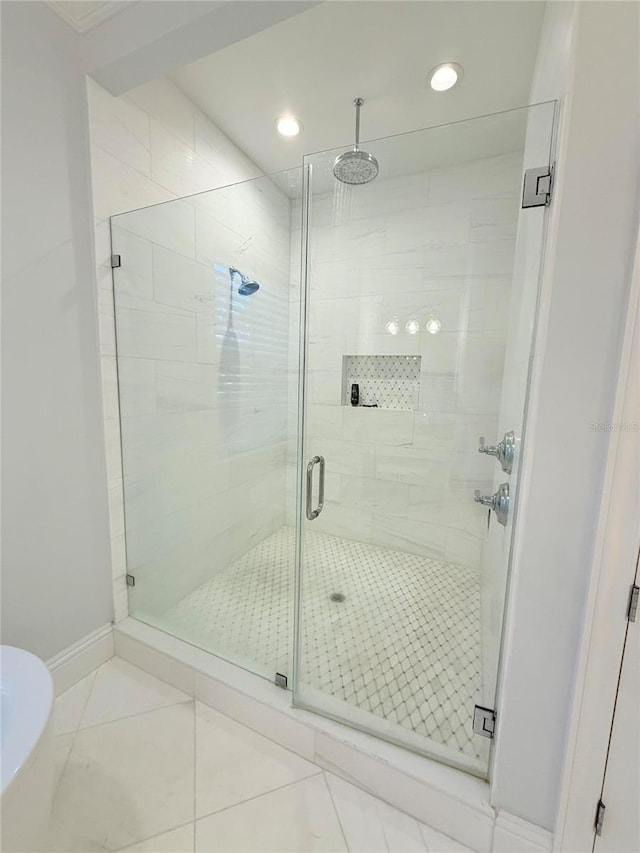 4309 W Beachway Dr, Tampa, FL 33609 - full bath with a shower stall, recessed lighting, and baseboards