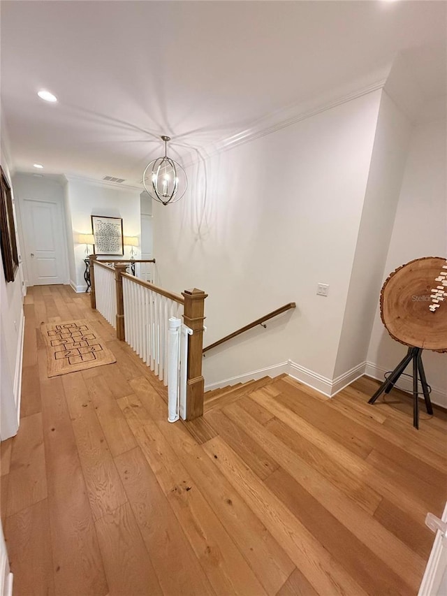 4309 W Beachway Dr, Tampa, FL 33609 - hall with an upstairs landing, light wood-style floors, recessed lighting, baseboards, and ornamental molding