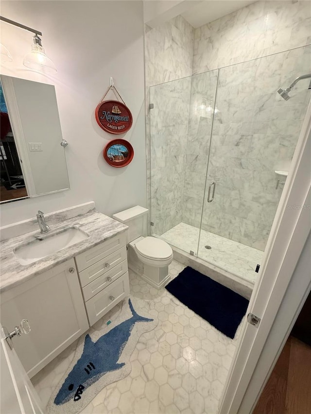 4309 W Beachway Dr, Tampa, FL 33609 - bathroom featuring a stall shower, vanity, and toilet