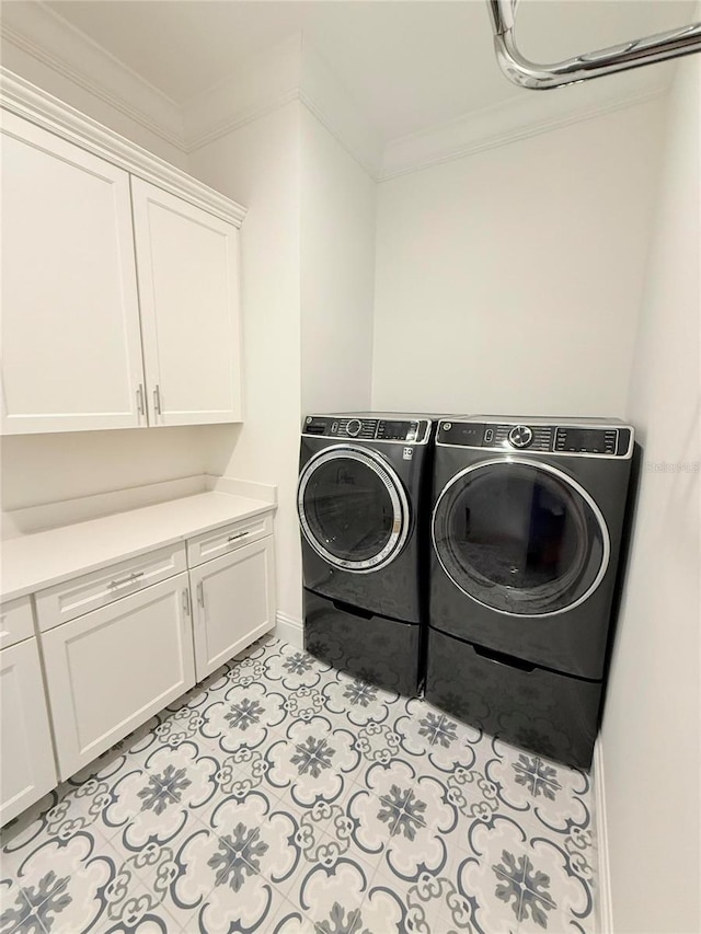 4309 W Beachway Dr, Tampa, FL 33609 - laundry area with cabinet space, independent washer and dryer, crown molding, and baseboards