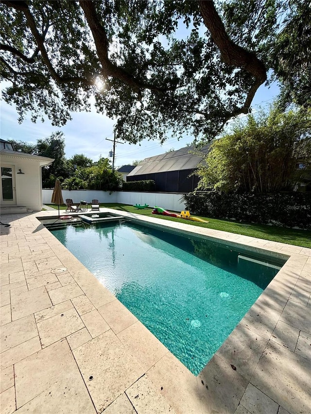 4309 W Beachway Dr, Tampa, FL 33609 - view of pool featuring a patio area, a fenced backyard, and a pool with connected hot tub