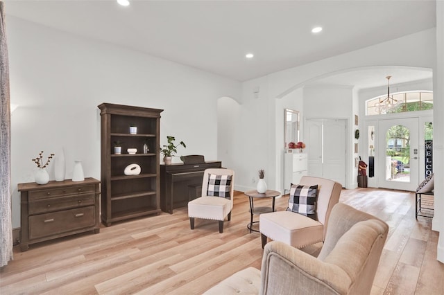 1932 Reed Hill Dr, Windermere, FL 34786 - living room featuring arched walkways, light wood finished floors, and recessed lighting