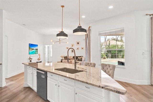 1932 Reed Hill Dr, Windermere, FL 34786 - kitchen with a sink, dishwasher, light wood-style flooring, a center island with sink, and white cabinets