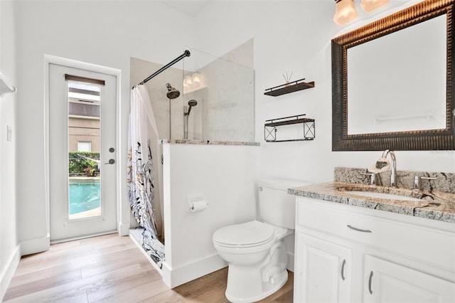 1932 Reed Hill Dr, Windermere, FL 34786 - full bath with toilet, wood finished floors, vanity, a shower with curtain, and baseboards