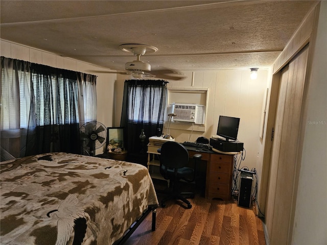 1525 Hilltop Rd, Casselberry, FL 32707 - bedroom with wood finished floors, a textured ceiling, and a desk