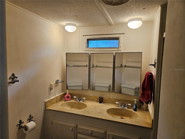 1525 Hilltop Rd, Casselberry, FL 32707 - bathroom with toilet, a textured ceiling, and double vanity