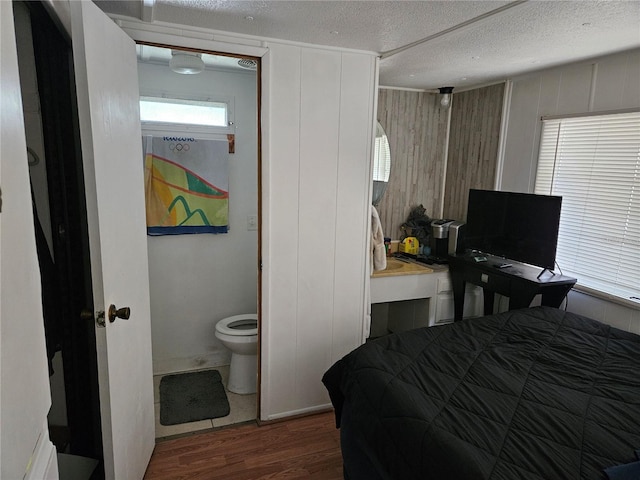 1525 Hilltop Rd, Casselberry, FL 32707 - bedroom with wood finished floors and a textured ceiling