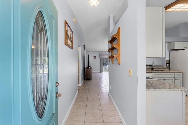 891 Licaria Dr, Ocoee, FL 34761 - hallway featuring light tile patterned flooring and baseboards