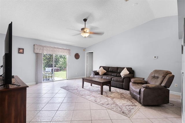 891 Licaria Dr, Ocoee, FL 34761 - living room with light tile patterned floors, vaulted ceiling, a ceiling fan, and a textured ceiling